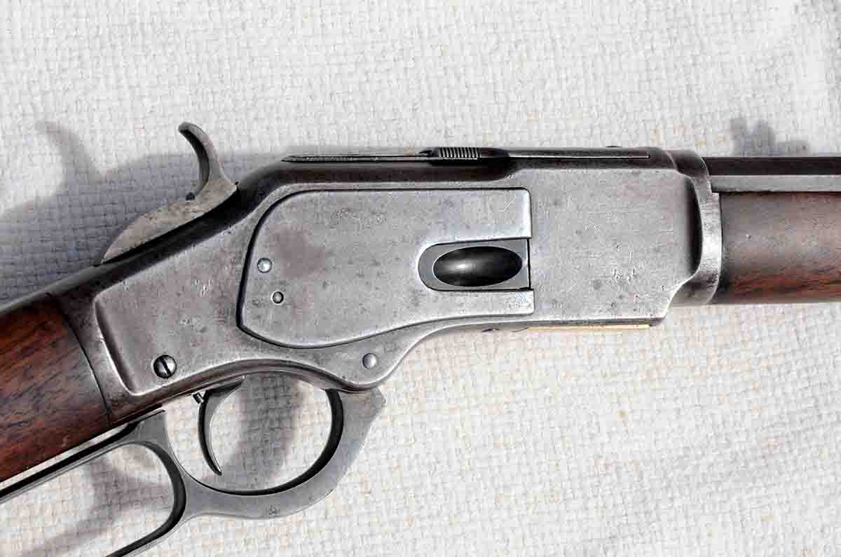 This vintage Model 1873 Winchester has a single-set trigger. Note the small screw behind the trigger.